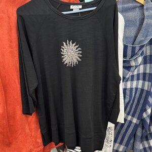 Elegant Black Long Sleeve Top with Sunburst Design